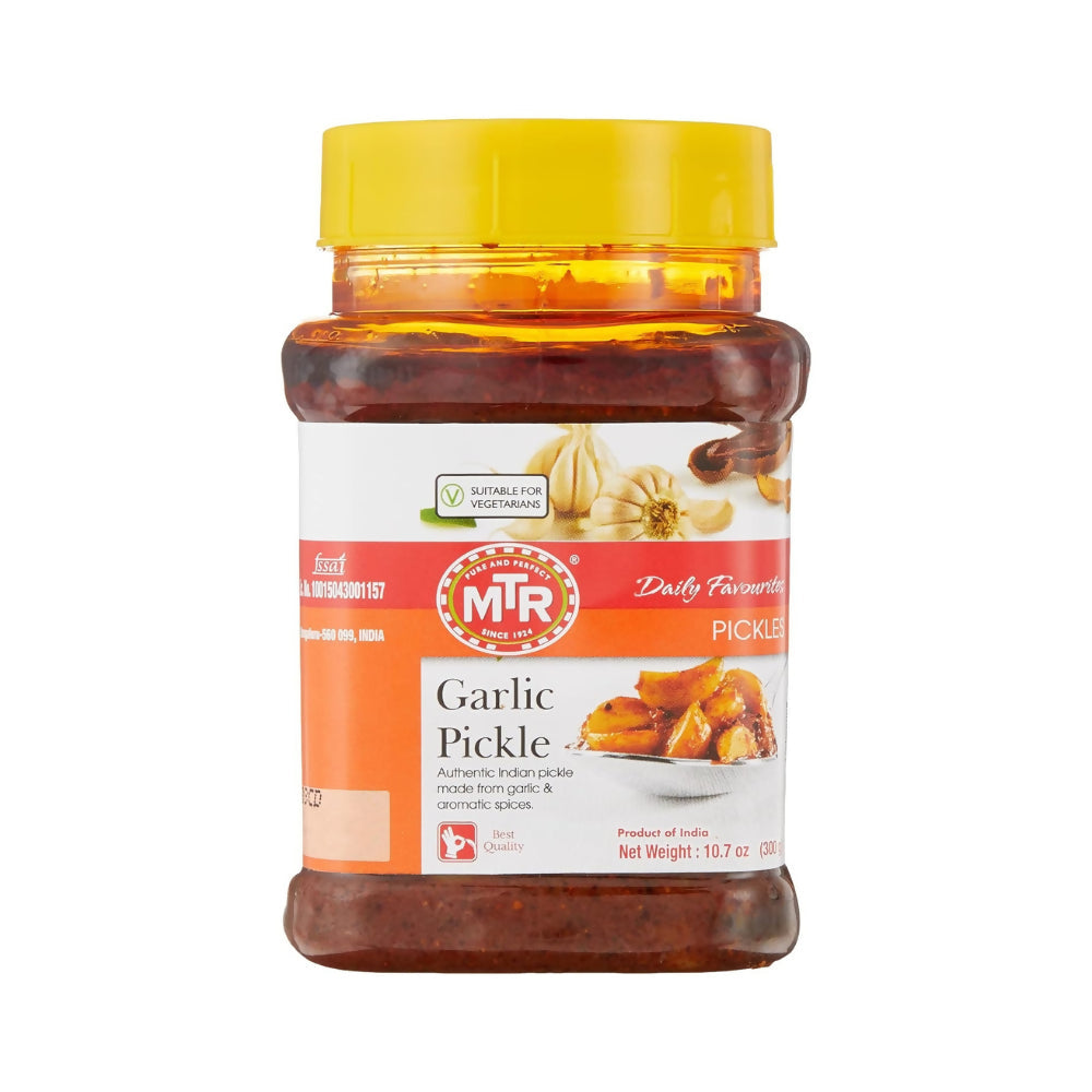 Jar of MTR Garlic Pickle with a yellow lid on a white background