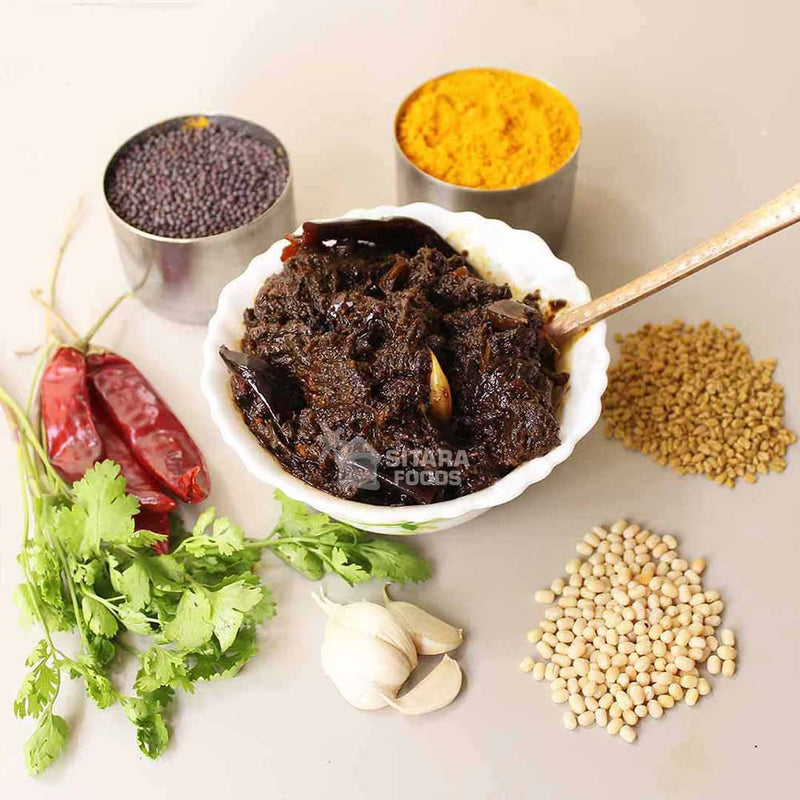Spice mix in a bowl with various spices and ingredients on a white background
