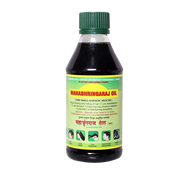 Bottle of Mahabhhringaraj Oil with green cap on a white background