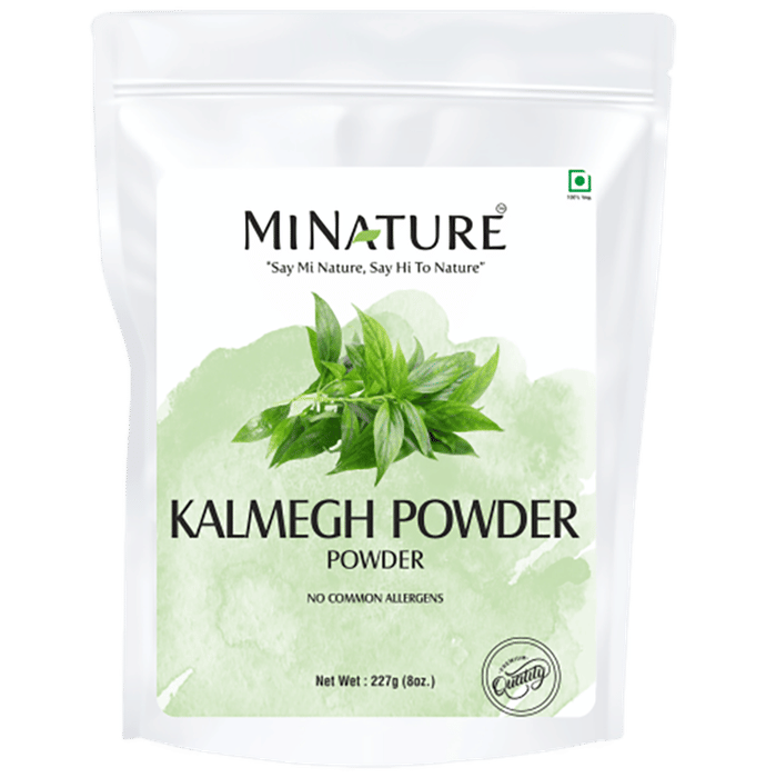 Minature Kalmegh Powder package with green leaves on a white background