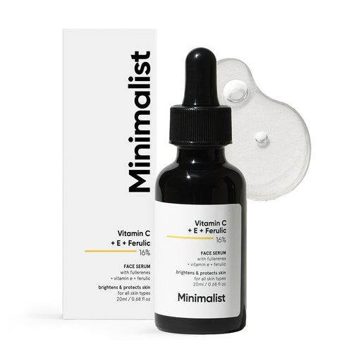 Black face serum bottle with dropper and packaging labeled 'Minimalist' on a white background