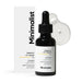 Black face serum bottle with dropper and packaging labeled 'Minimalist' on a white background