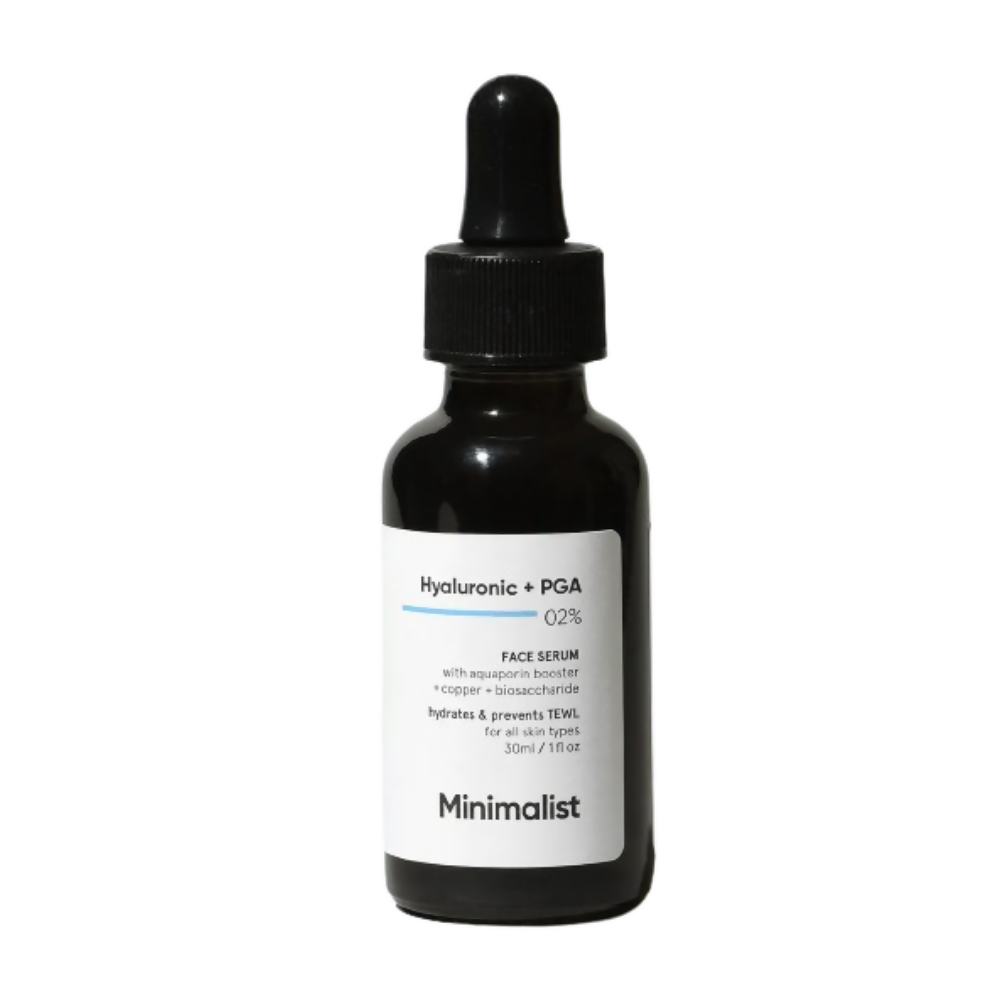 Black bottle of face serum with dropper labeled 'Minimalist' on a white background