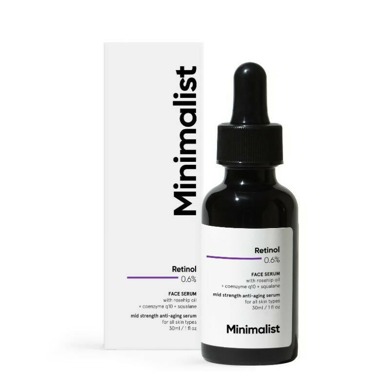 Minimalist skincare serum bottle with dropper and packaging on a white background