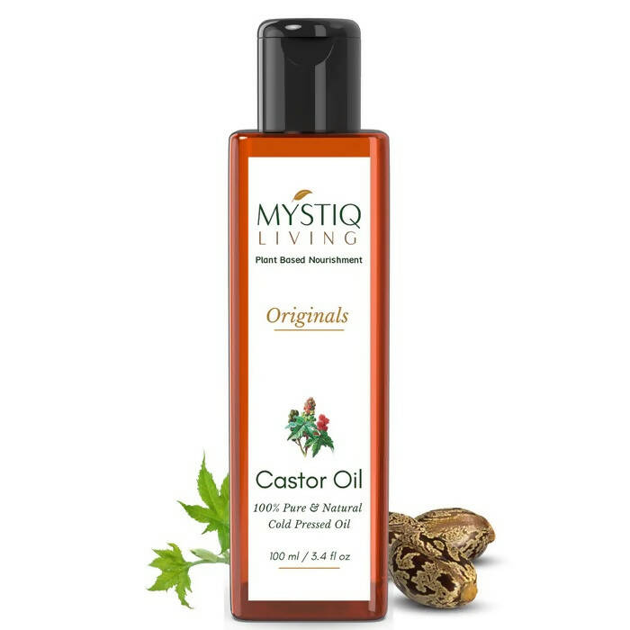 Mystiq Living Castor Oil bottle with leaves and seeds on a white background