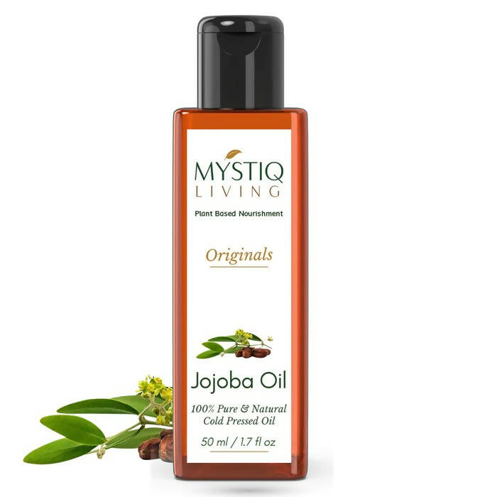 Bottle of Mystiq Living Jojoba Oil on a white background