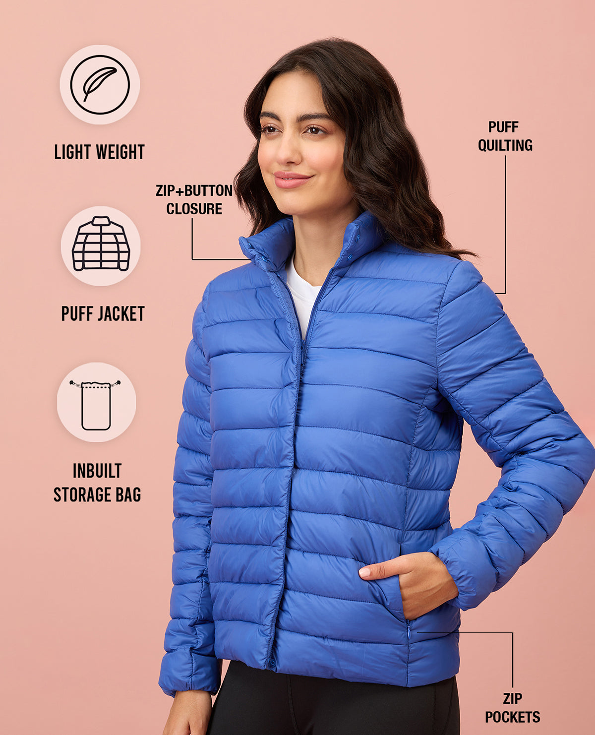 Woman wearing a blue puffer jacket with feature icons on a pink background