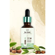 Bottle of Nat Habit jojoba oil with dropper on a natural background