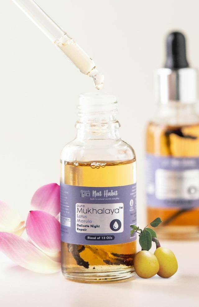 Bottle of Mukhalaya with a dropper on a light background
