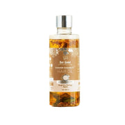 Bottle of hair oil with a label on a white background