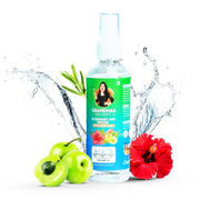 Bottle of Grandma's Secret Rosemary Ark Water with apples and a red flower on a white background