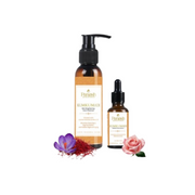 Two bottles of Parmesh Kumkumadi oil with flowers on a white background