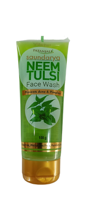 A tube of Patanjali Saundarya Neem-Tulsi Face Wash with green and white color scheme and branding information.