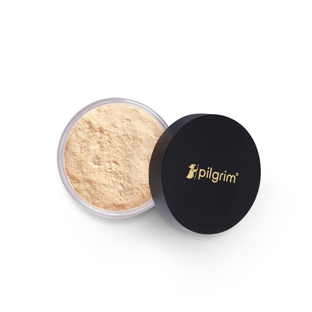 Open container of powder with black lid featuring 'pilgrim' brand on a white background