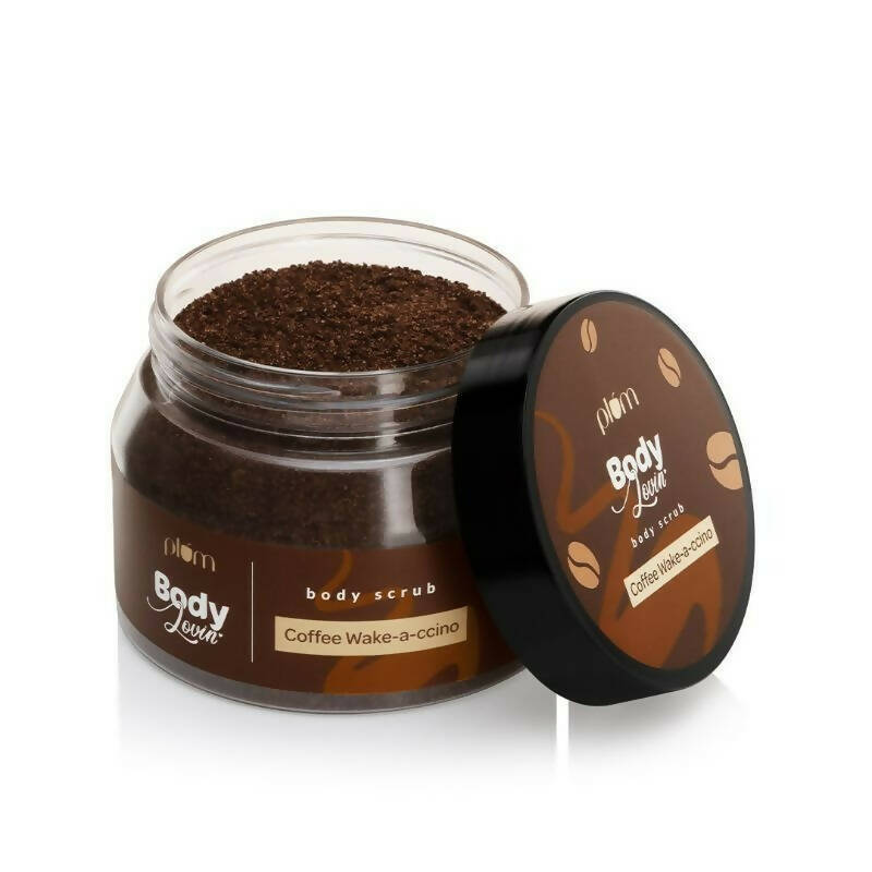 Jar of coffee body scrub with open lid on a white background