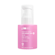 Pink skincare serum bottle with white cap on a white background