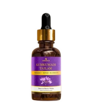 Bottle of Kumkumadi Tailam with a dropper on a white background