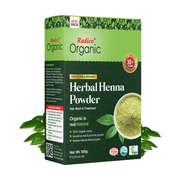 Box of Radico Organic Herbal Henna Powder with green leaves on a white background