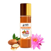 Rishi Kumkumadi oil bottle with ingredients and a pink flower on a white background