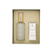 Two skincare products in a decorative box with a white background