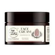 Jar of Shat Pratishat face cream with cedarwood oil on a white background