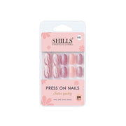 Pack of Shills press-on nails with pink and glittery design on a white background