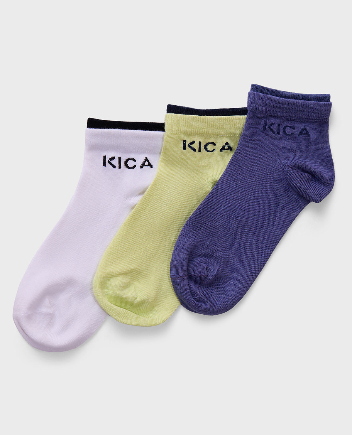 Three pairs of socks in purple, green, and pink with 'KICA' branding on a light gray background.