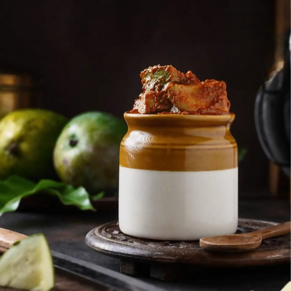 Ceramic jar with food on a dark background