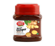 Jar of Tasty Nibbles Mango Ginger Pickle with a red lid on a white background