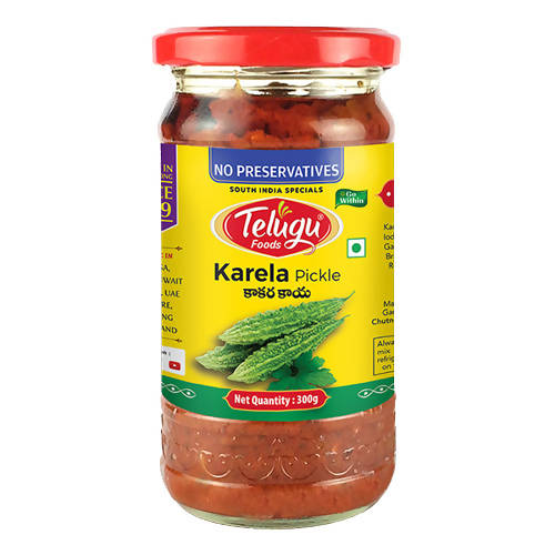 Jar of Telugu Foods Karela Pickle with a red lid on a white background