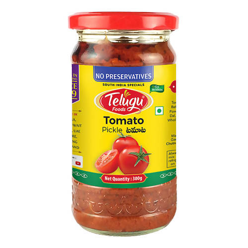 Jar of Telugu Tomato Pickle with a red lid on a white background