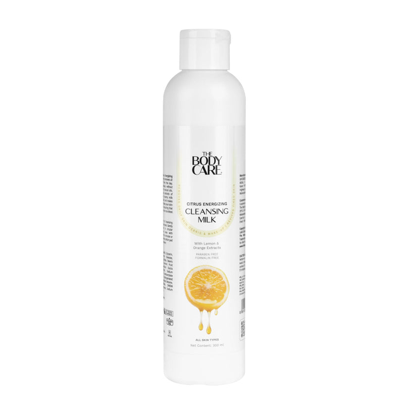 White bottle of 'The Body Care' cleansing milk with lemon graphic on a white background