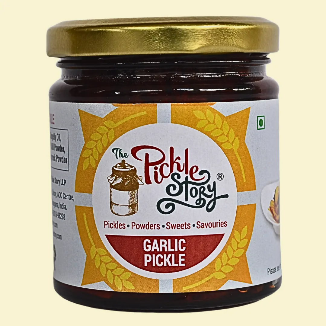 Jar of Garlic Pickle with 'The Pickle Story' label on a beige background
