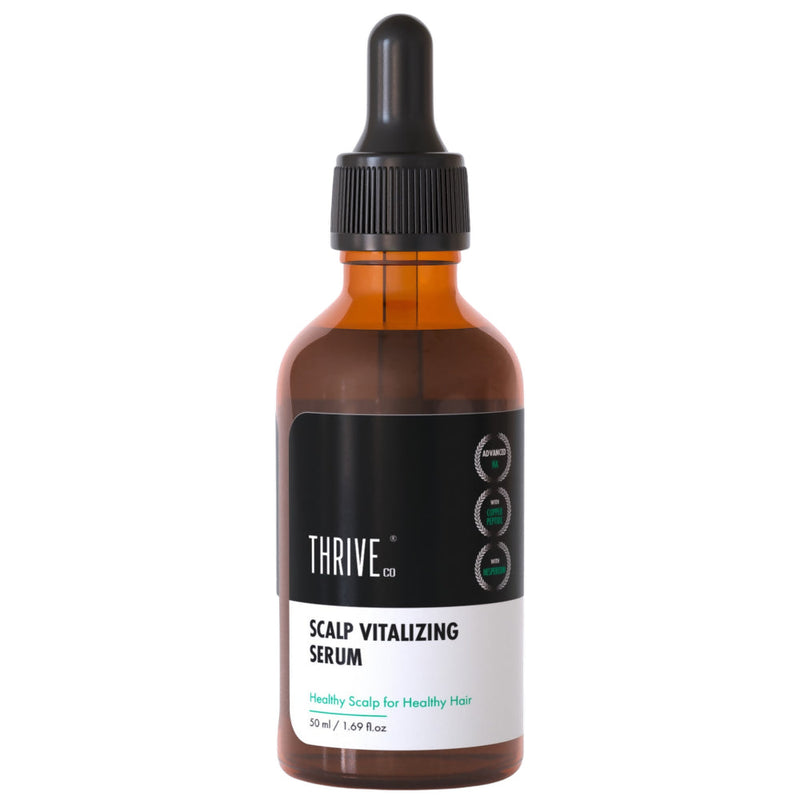 Bottle of Thrive Scalp Vitalizing Serum on a white background