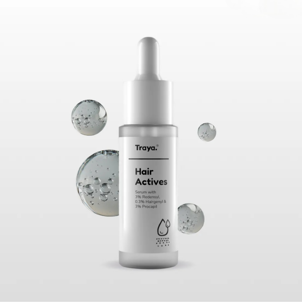 Traya Hair Actives serum bottle on a light gray background