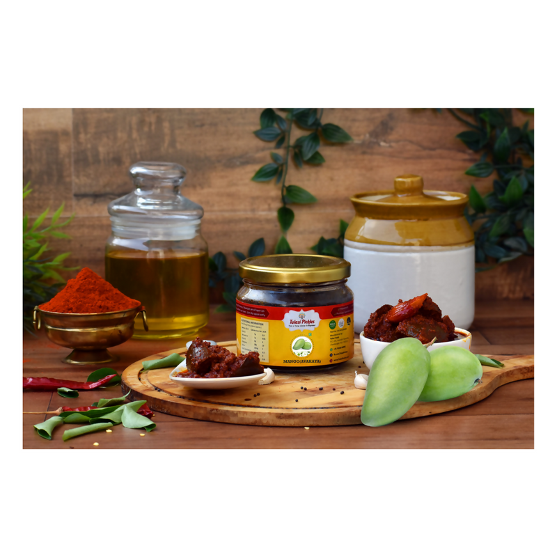 Spices, oils, and fruits on a wooden surface with a rustic background