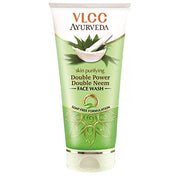 A plastic tube of VLCC Ayurveda skin purifying double power double neem face wash with green and white color scheme and branding details.