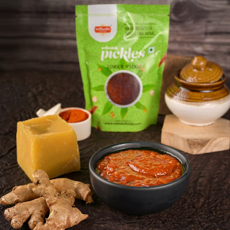 Ginger pickle with packaging, ginger root, and a wooden background