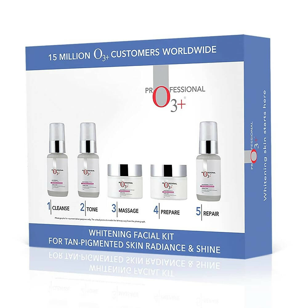 Whitening facial kit packaging with bottles and jars on a white background