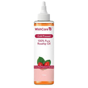 Bottle of WishCare 100% Pure Rosehip Oil on a white background