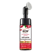 A bottle of WOW Skin Science Apple Cider Vinegar Foaming Face Wash with a brush applicator on top. The label has red and white colors with text and branding.