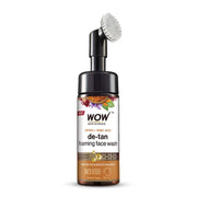 A bottle of WOW Skin Science Ubtan Foaming Face Wash with Turmeric & Saffron, featuring a built-in brush for deep cleansing, on a white background.