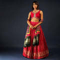 Apple Red Lehenga In Bandhani Printed Satin With Zardosi Embroidered Choli And Patola Dupatta