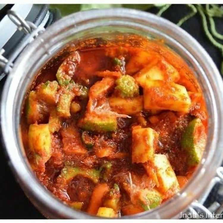 Jar of spicy vegetable dish with okra and tomatoes