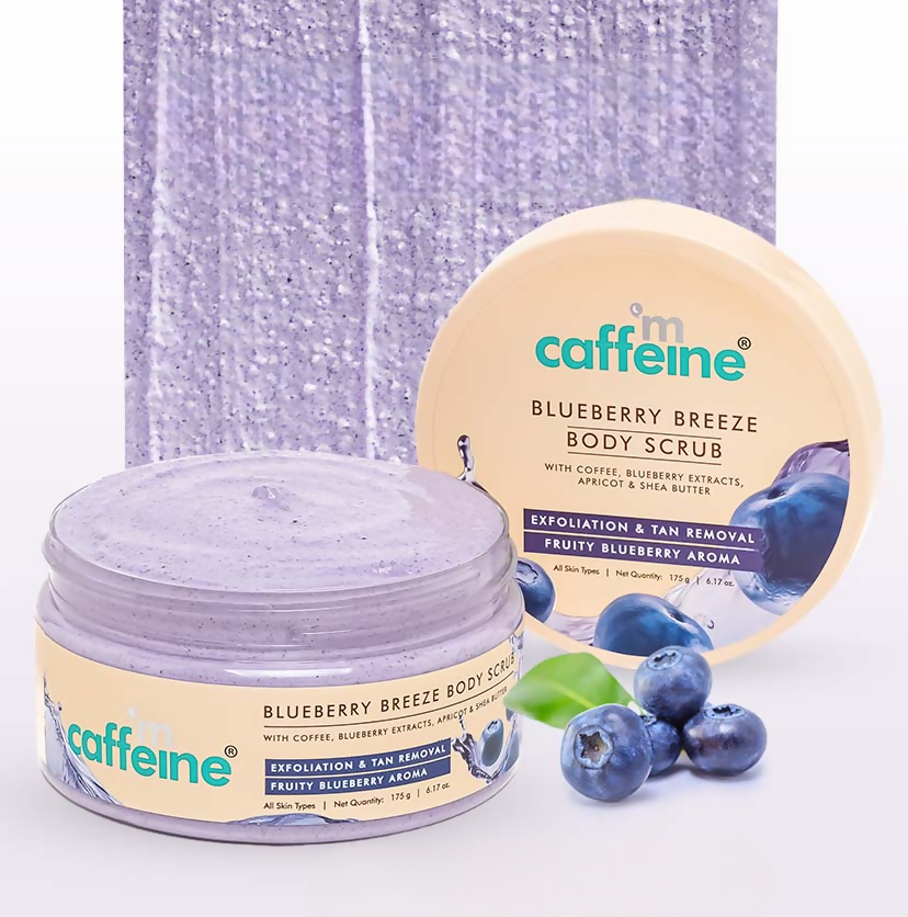 Caffeine Blueberry Breeze body scrub jars with blueberries on a white background