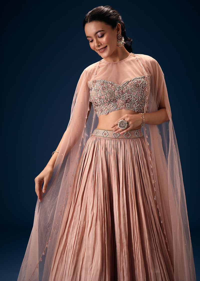Peach Ruched Lehenga With Embroidered Blouse and Net Cape