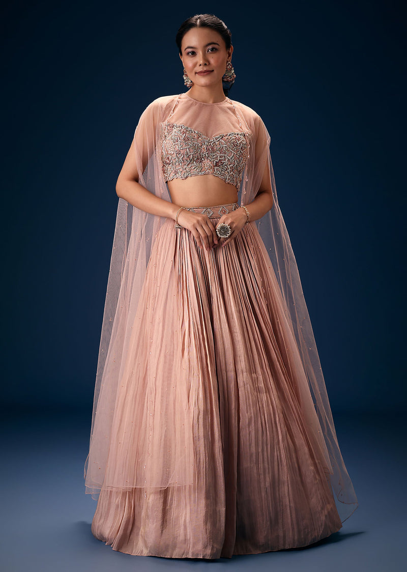 Peach Ruched Lehenga With Embroidered Blouse and Net Cape