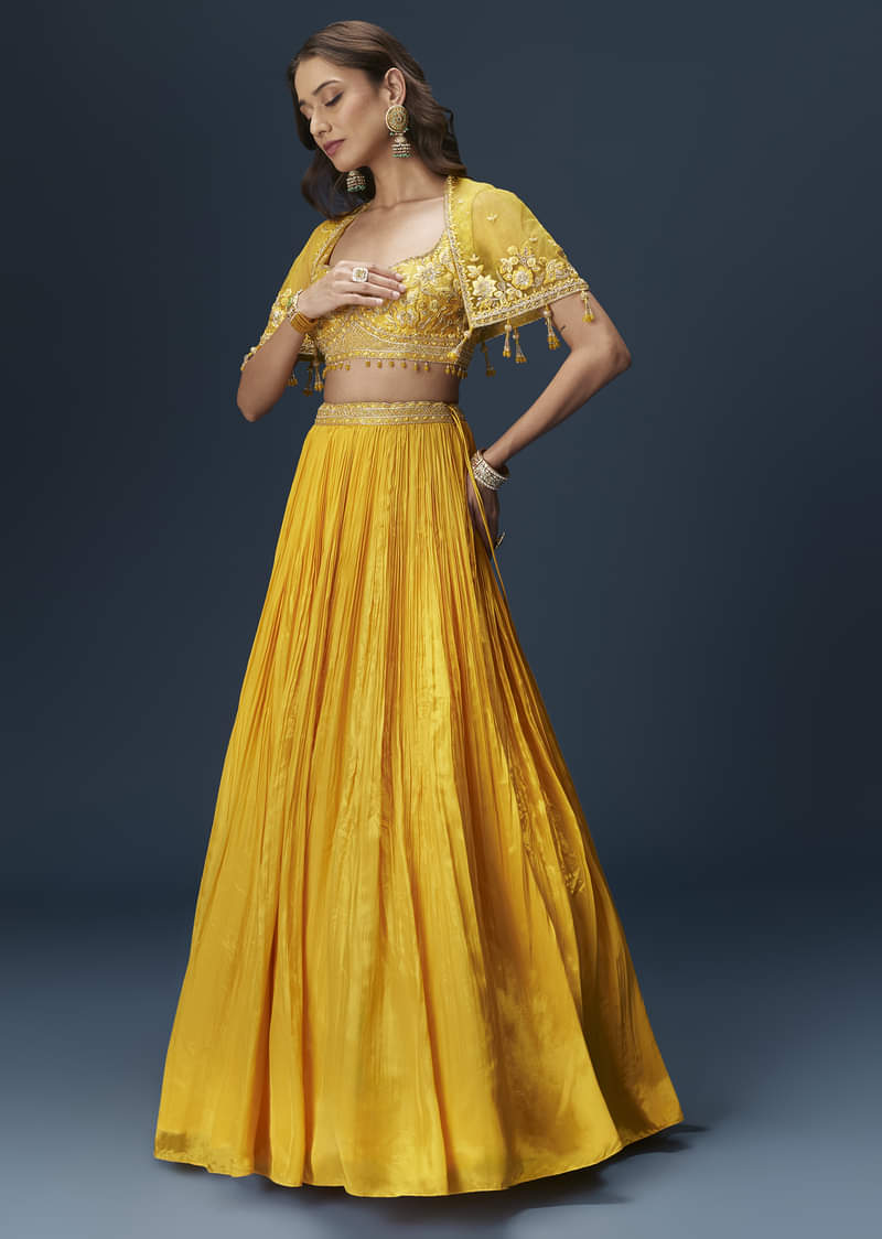 Yellow Bridesmaid Lehenga With Sleeveless Blouse And Draped Cape