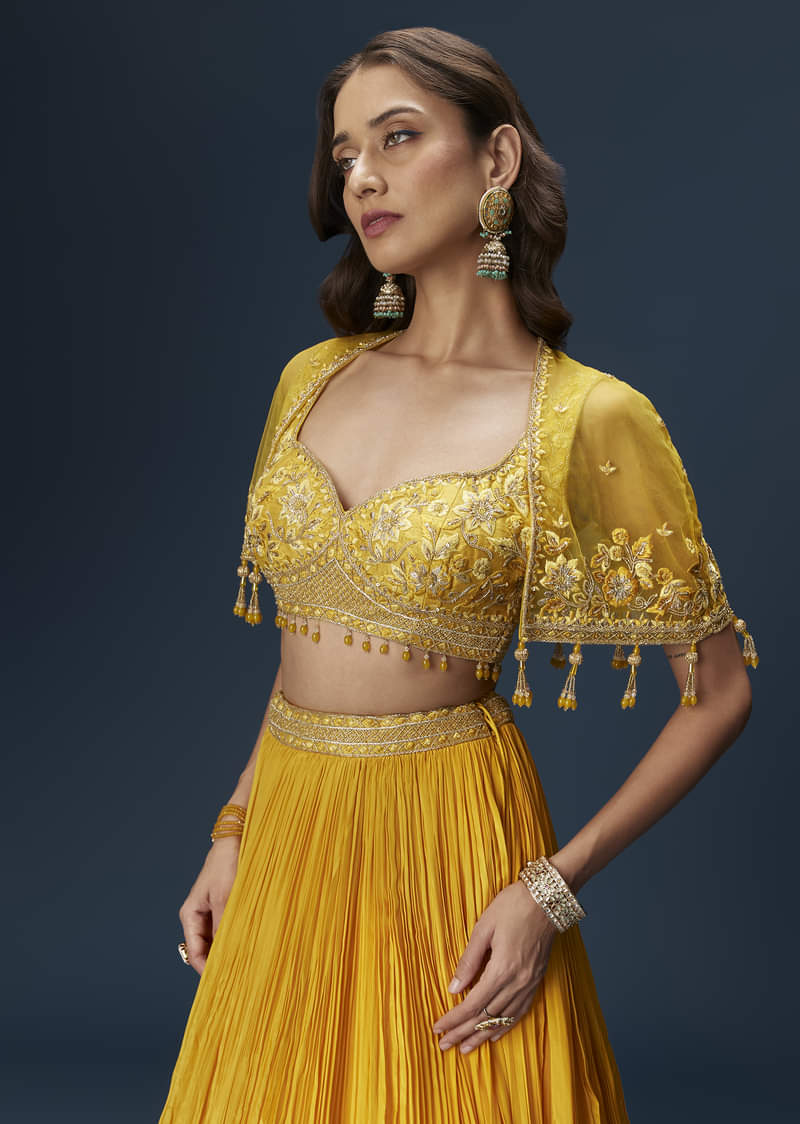 Yellow Bridesmaid Lehenga With Sleeveless Blouse And Draped Cape
